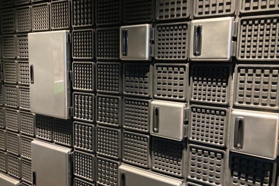 A textured wall of waffle patterns.