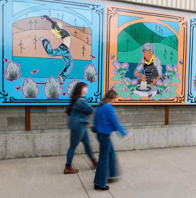 People walking in front of artwork outside of the Rotary Centre for the Arts