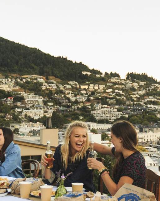 Backpackers dining on Queenstown Lakefront