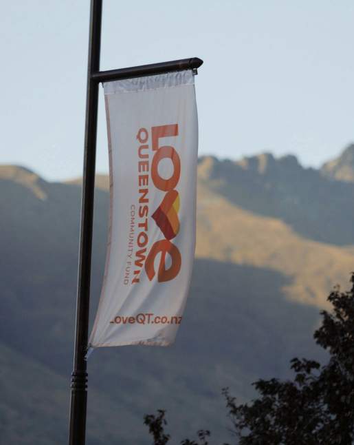 Love Queenstown Flag in front of Cecil Peak
