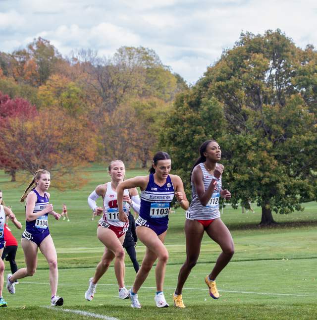 A group of women racing during the Big Ten cross country championships