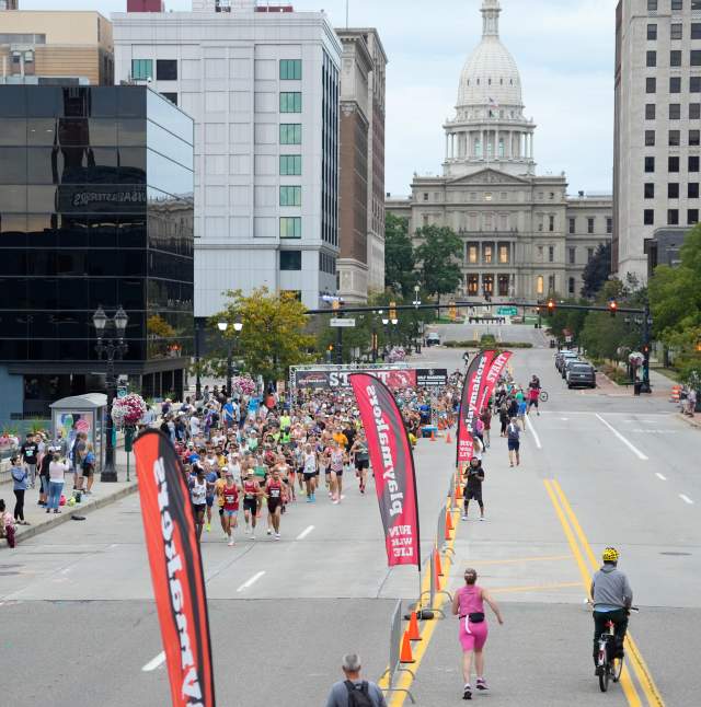 Capital City River Run in downtown Lansing with a view of the state capitol in the background.