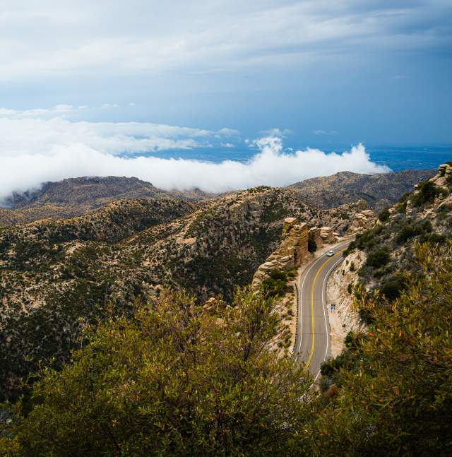 aerial view of the Catalina Highway, blue sky, and desert scenery at Windy Vista Point on Mount Lemmon.