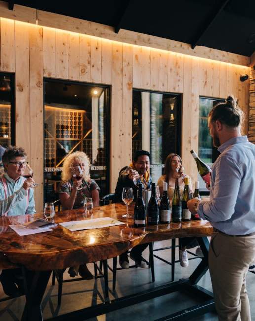 A group of people attending a wine tasting at Kinross in Gibbston near Queesntown