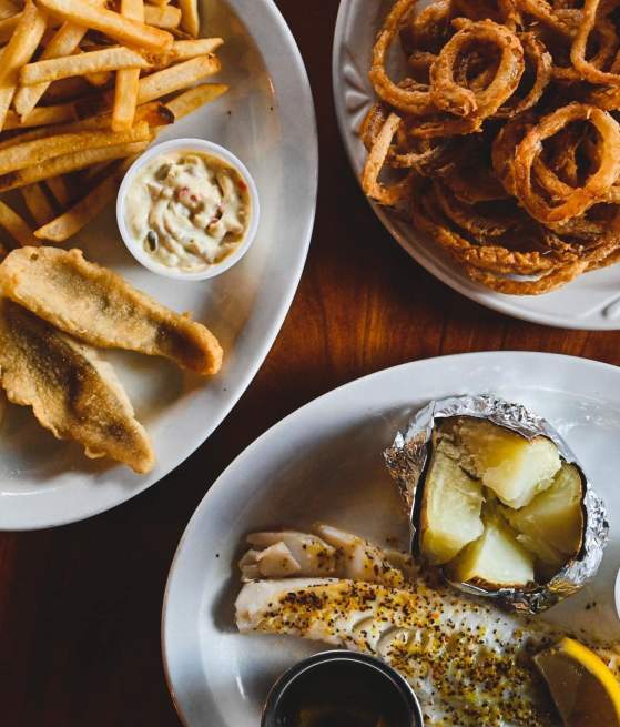 fish fry, fries and potato on plates