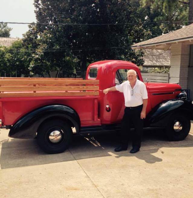 Ray Pellerin next to red truck