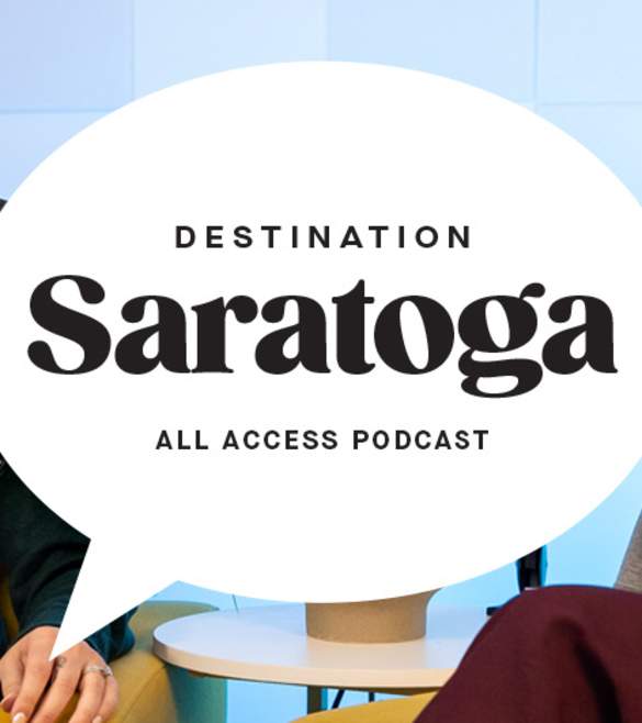 two women in chairs with headphones on