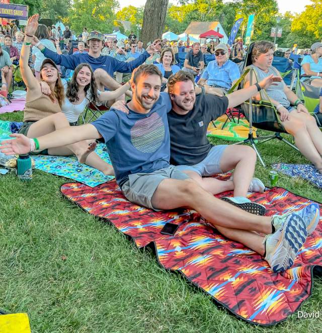 Smaller Copy of Crowd gathered on a lawn to listen to Live Music