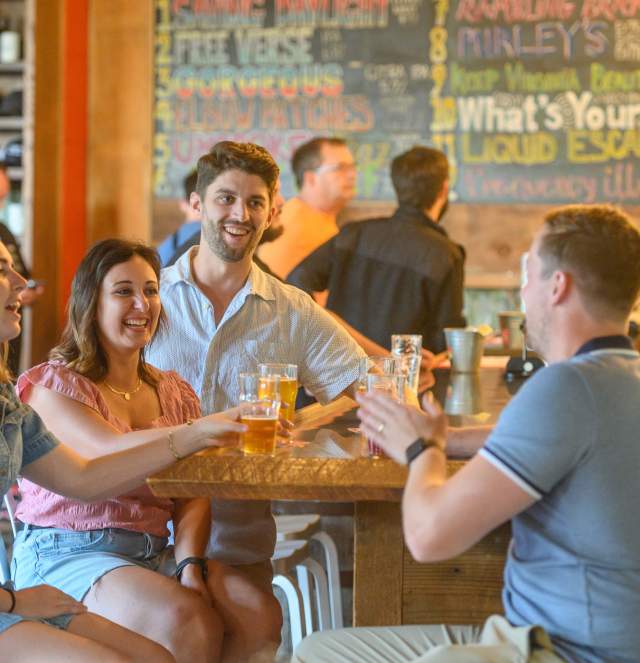 Group of young adults drinking at a brewery