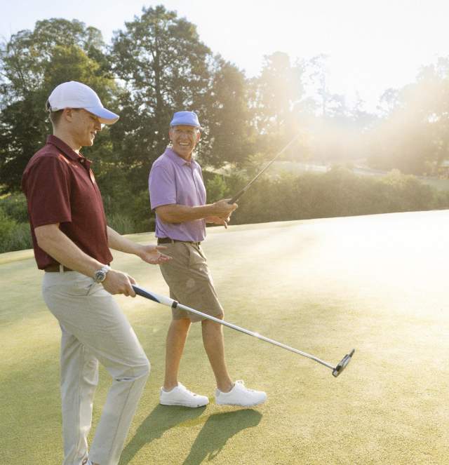 Two Men Golfing at the Golden Horseshow