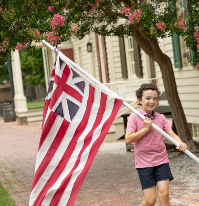 Child holding the Flag at Colonial Williamsburg
