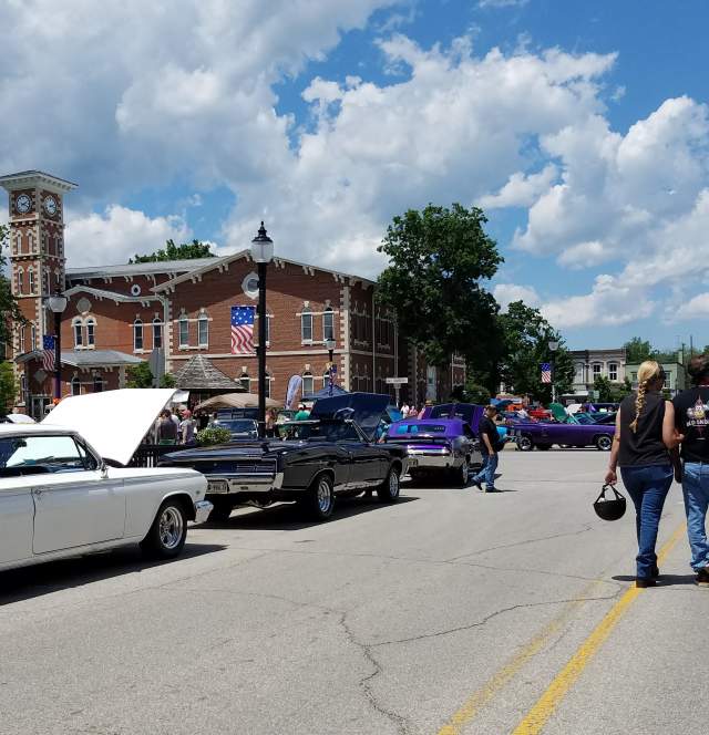 A couple strolls through the Anything on Wheels Car Show, Memorial Day Weekend in downtown Martinsville, Indiana.