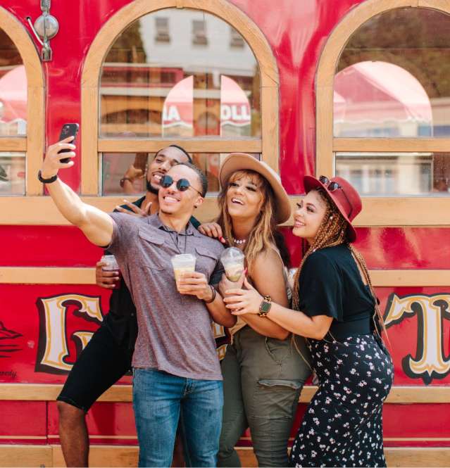 Friends taking a selfie in front of Trolley in Galena, IL