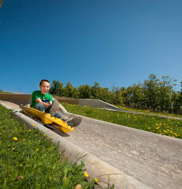 Alpine Slide Summer Lutsen Mountains MN Outdoor Kid on alpine slide eagle mountain