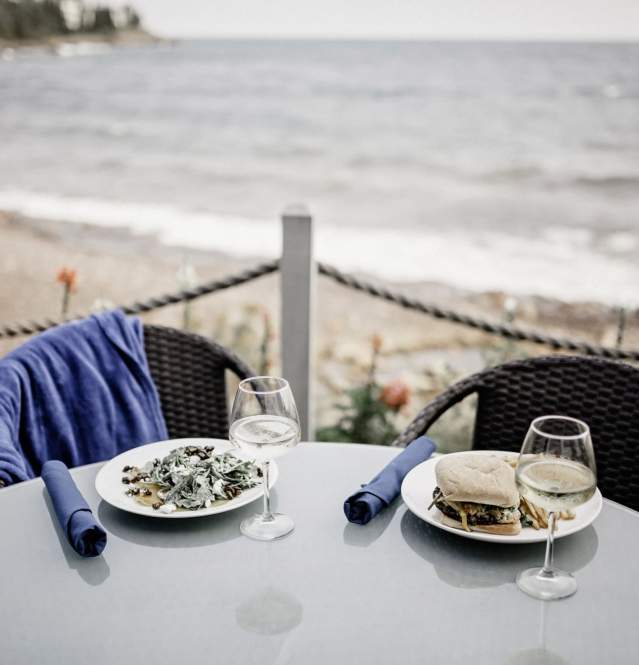 Outdoor dining table with meal and wine