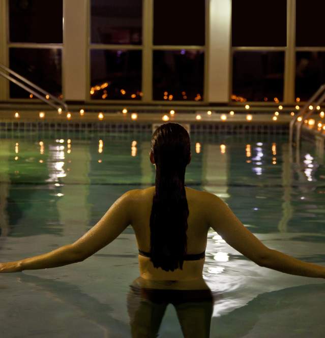 Women relaxing in pool at spa