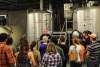 Visitors listen intently during a Tin Roof Brewery tour in Baton Rouge, Louisiana.