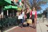 Woman walking downtown carrying shopping bags