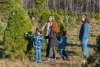a family picks out their Christmas tree at Erin's Christmas Tree Farm