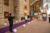 people walking down purple carpet strip in performing arts complex