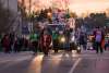 people walking in the christmas parade for lighting up downtown