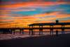 A vibrant sunset at the St. Simons Fishing Pier