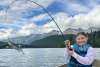 Child Fishing with fish on pole - Middle of chilkat lake