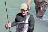 Father and son fishing, salmon in net, chilkoot lake