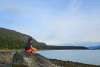 Child sitting on large rock enjoying view at Chilkat State Park