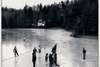 Ice skating on Mirror Lake under the lights. Mirror Lake and Lake Sequoyah supplied both ice for food storage and recreation before general warming led to milder winters.  Photo ca. 1955.
