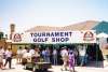 Booth at a golf tournament that says tournament golf shop
