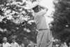 Black and white image of golfer Byron Nelson swinging his club over his shoulder