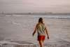 person walking on a beach