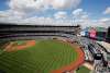 Angled view of Yankees Stadium with a clouded blue sky