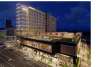 Rendering of Omni Hotel exterior with pool deck at night