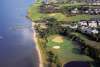 Aerial view of a golf course along the coast in the Outer Banks