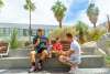 Gay family eating ice cream outdoors in Palm Springs.