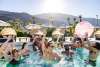 Group of triends partying in pool.