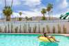 Man in pool at the Marley Hotel in Palm Springs