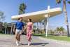 Couple walking at Escena golf resort.