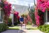 Couple walking down sidewalk.