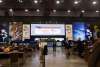 Panama Convention Center, a modern and spacious building with large windows and a sleek design.  It is located on the Amador Causeway, offering stunning views of the Pacific Ocean and the Bridge of the Americas.
