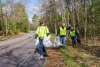 Trash being picked up along the road
