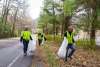 Trash being picked up along the road