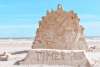 Clock sculpture made of sand.