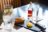 Glasses, bread and butter on a table