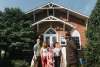 A family listening to a story in front of town hall in Occoquan