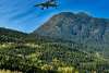 PLANE FLYING PAST AB MOUNTAIN