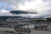 Cruise Ships early morning in Port at Skagway, with dramatic low clouds as the sun rises