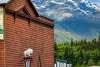 Title: Where History Meets the Mountains Historic Skagway sits beneath the towering peaks of Alaska’s Coast Mountains, where Gold Rush history meets breathtaking wilderness. As the clouds lifted, the landscape revealed the timeless beauty that makes this remarkable town unforgettable.